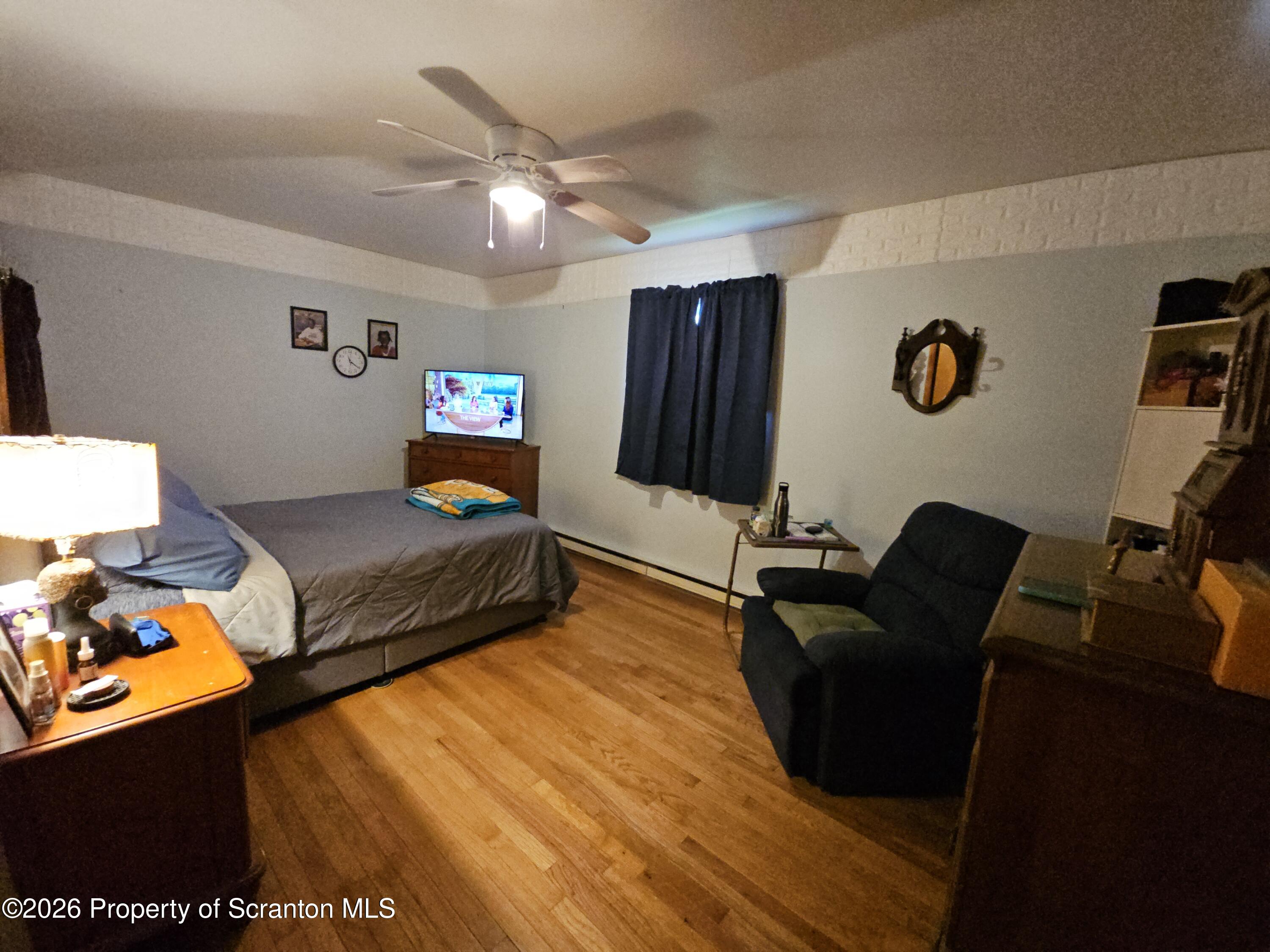 405 Baker Street Taylor, PA 18517 - Photo 25 of 36 a living room with furniture and a flat screen tv