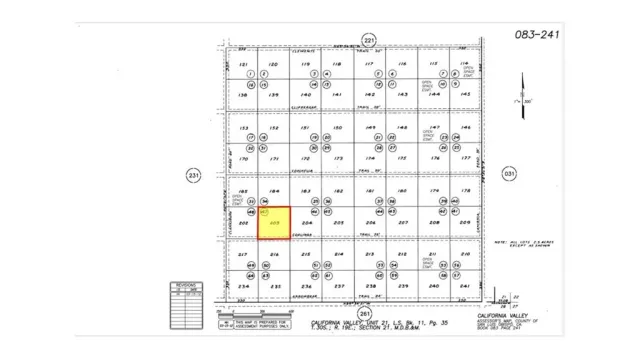 a view of grassy field with mountain