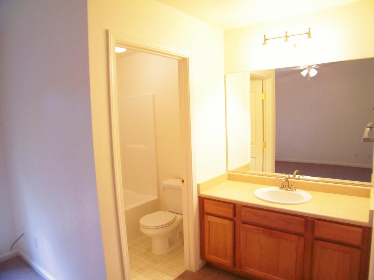 1160 Echo Road Redding, CA 96002 - Photo 12 of 15 a bathroom with a sink a toilet and shower