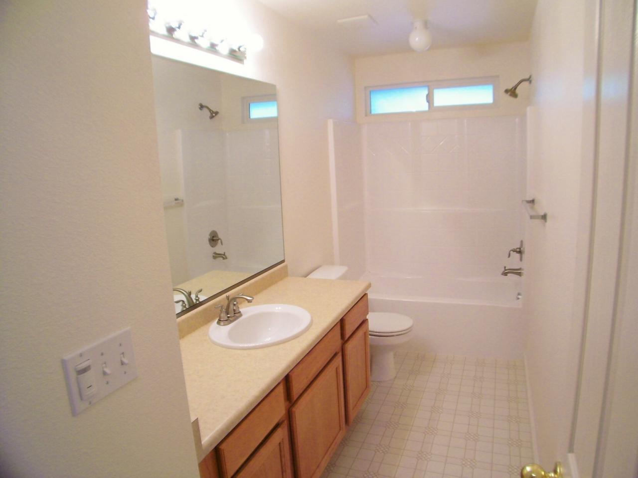 1160 Echo Road Redding, CA 96002 - Photo 7 of 15 a bathroom with a sink a toilet and shower