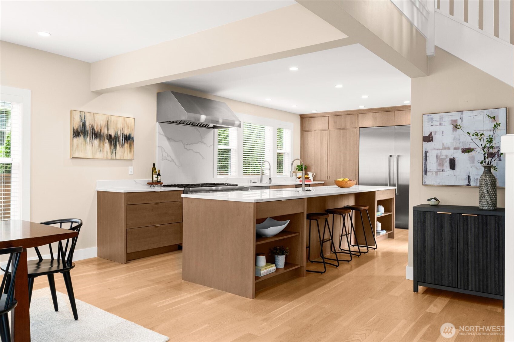 170 Lynn Street Seattle, WA 98109 - Photo 10 of 40 a kitchen with stainless steel appliances granite countertop a stove and a refrigerator
