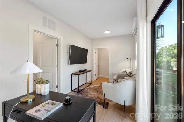 a living room with furniture and a window