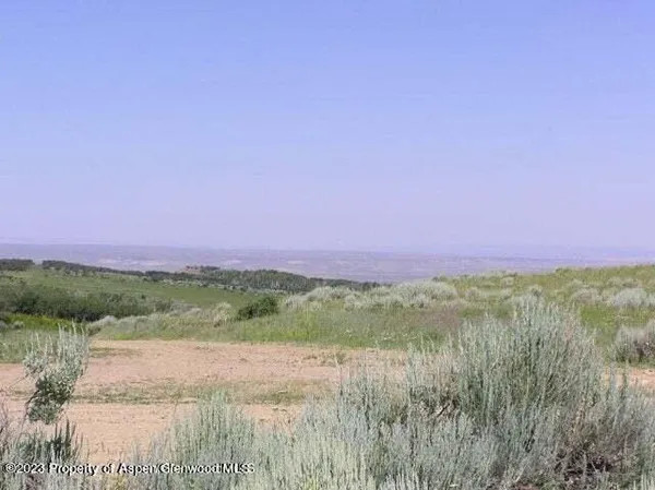 a view of a lake with a yard