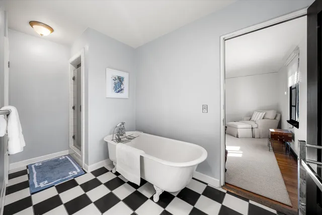 a bathroom with a sink a toilet a shower and a mirror