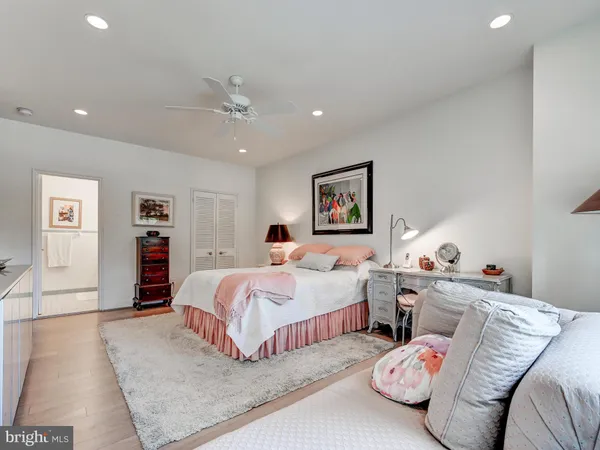 a bed room with a bed and a chandelier