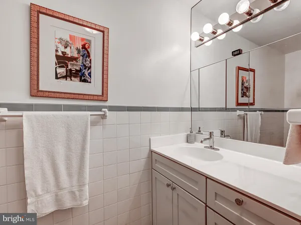 a bedroom with bed and a chandelier