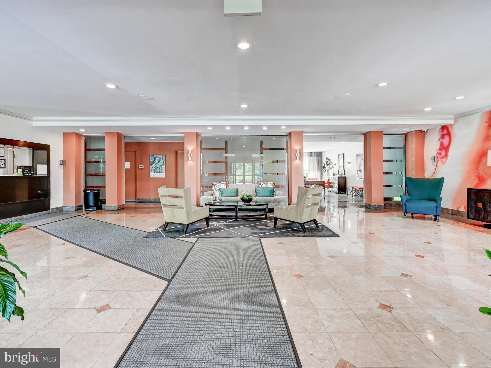 11 Slade Avenue, Unit 410 Pikesville, MD 21208 - Photo 25 of 32 a living room with furniture and a table