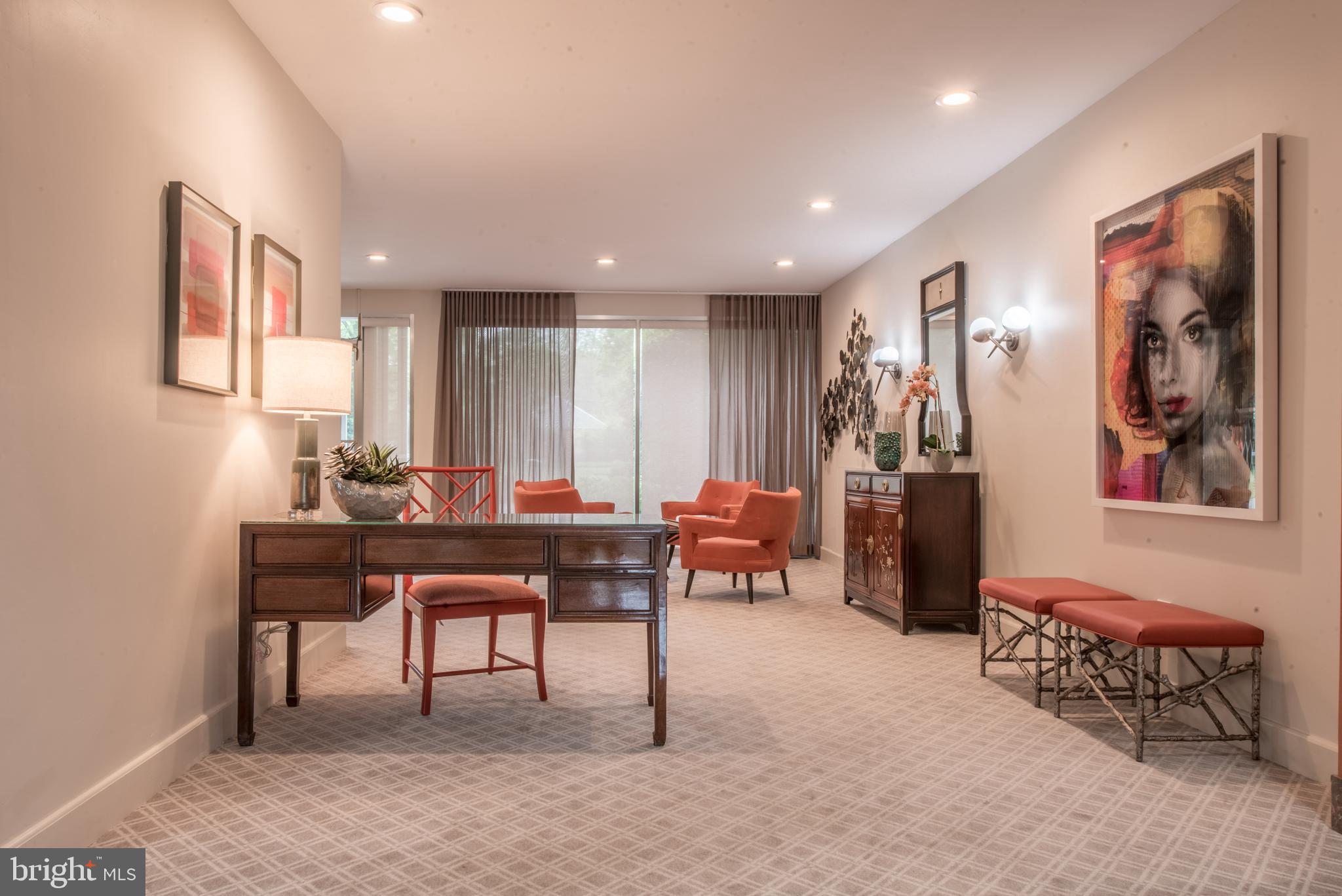 11 Slade Avenue, Unit 410 Pikesville, MD 21208 - Photo 26 of 32 a view of a livingroom with furniture and a potted plant