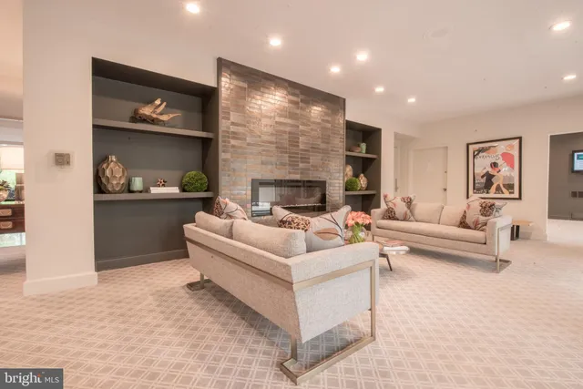 a view of a livingroom with furniture and a potted plant