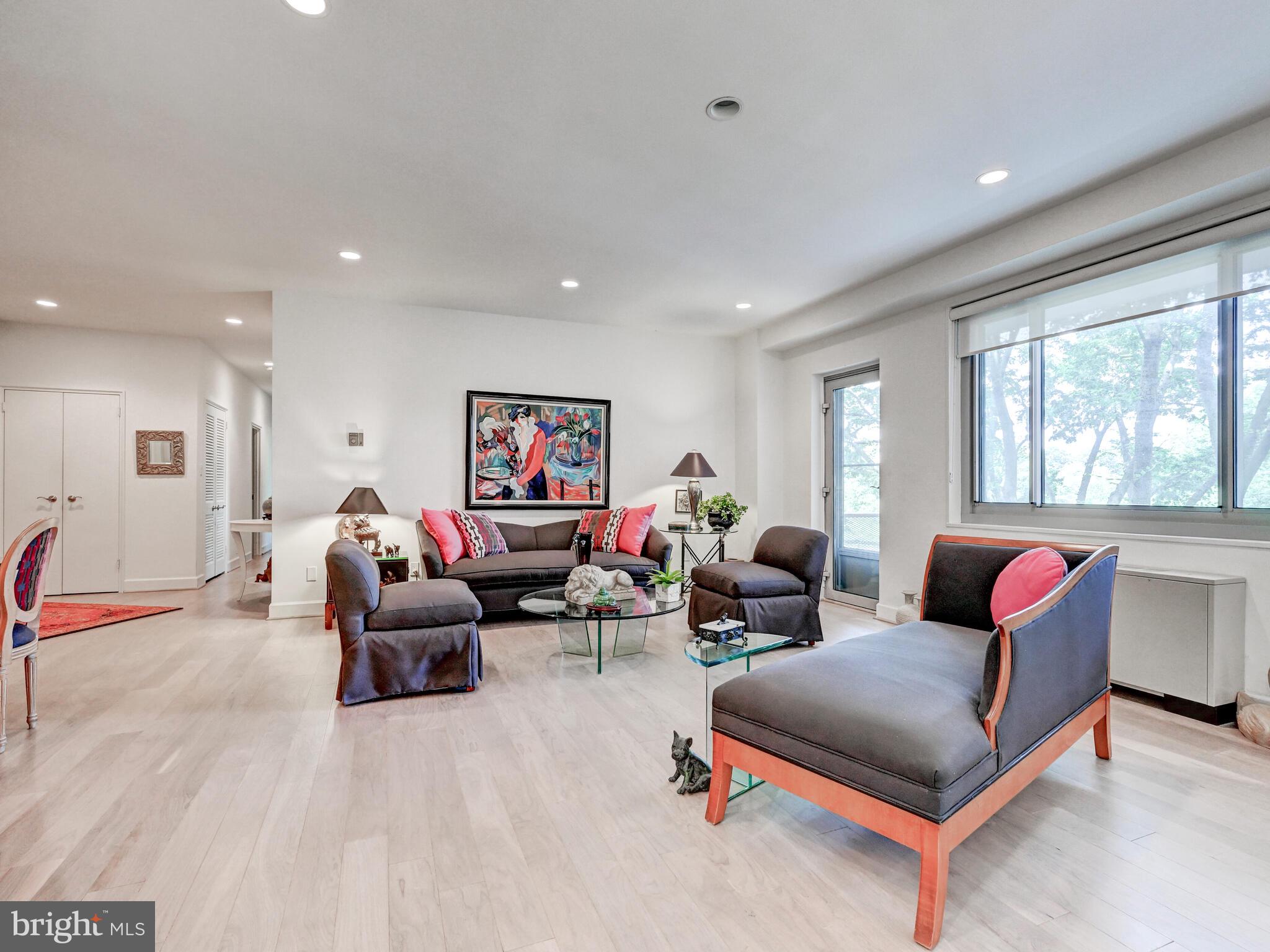 11 Slade Avenue, Unit 410 Pikesville, MD 21208 - Photo 5 of 32 a living room with furniture and a large window
