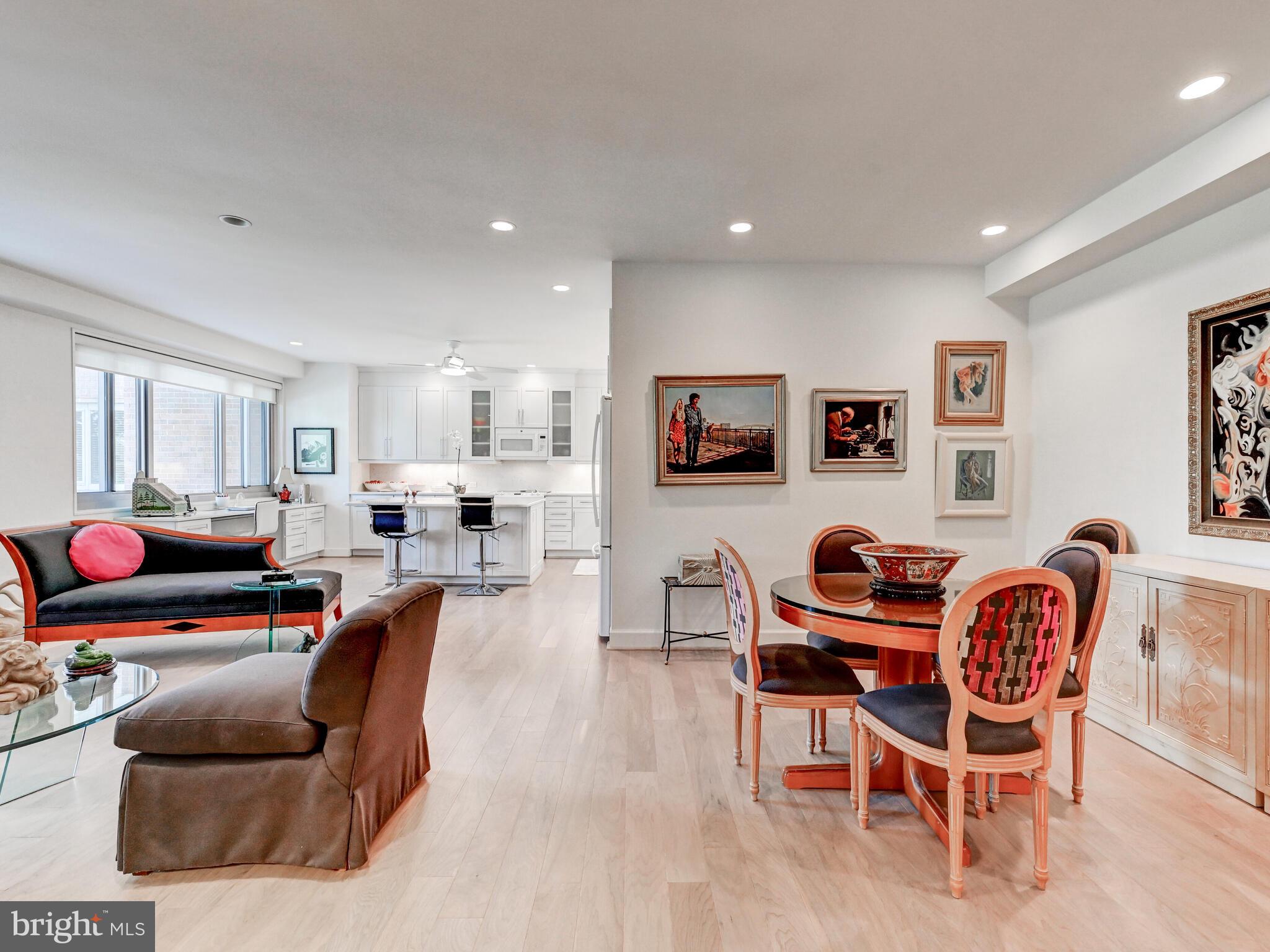 11 Slade Avenue, Unit 410 Pikesville, MD 21208 - Photo 6 of 32 a living room with furniture and a flat screen tv