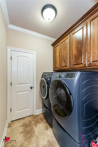 a view of livingroom with furniture and chandelier fan