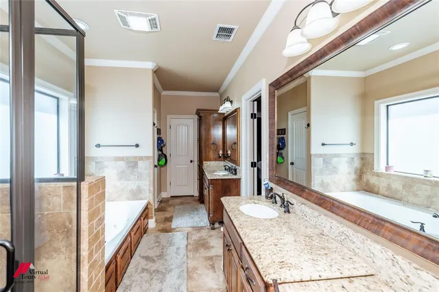 a bathroom with a bathtub and a shower