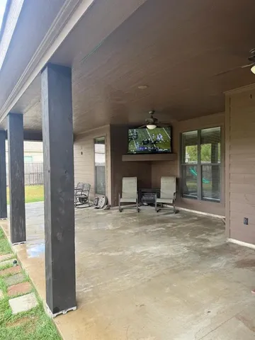 a large spacious bathroom with a granite countertop sink a mirror and shower