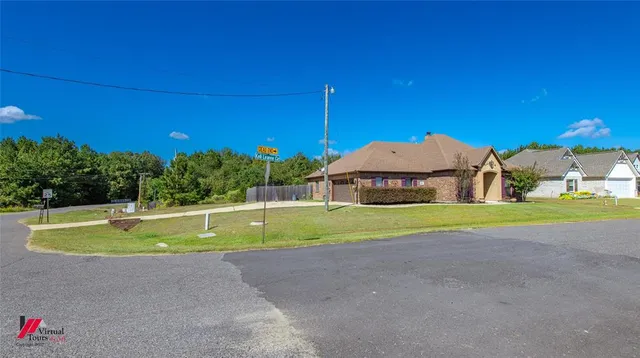a view of yard with swimming pool and yard