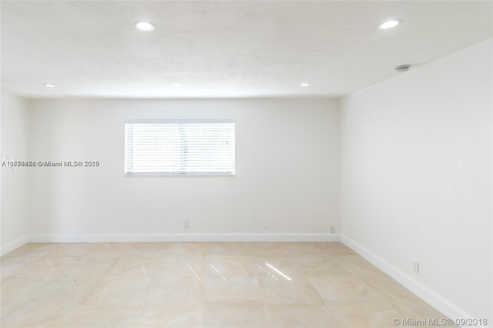 2201 Northeast 14th Avenue, Unit 3 Wilton Manors, FL 33305 - Photo 22 of 27 a view of a room with window