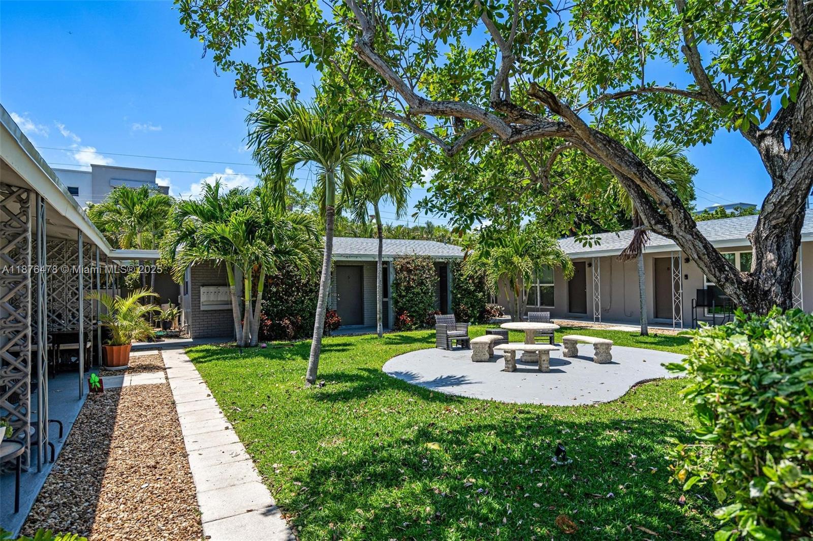 2201 Northeast 14th Avenue, Unit 3 Wilton Manors, FL 33305 - Photo 10 of 27 a view of a house with backyard sitting area and garden