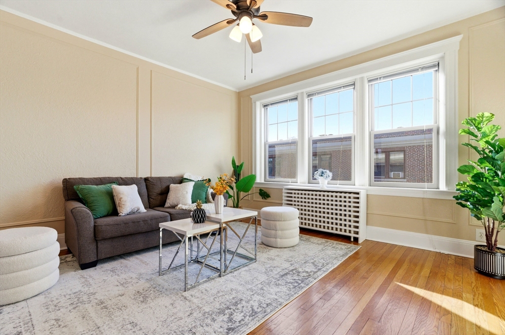 401 Washington Street, Unit 6 Brookline, MA 02446 - Photo 3 of 24 a living room with furniture and a large window