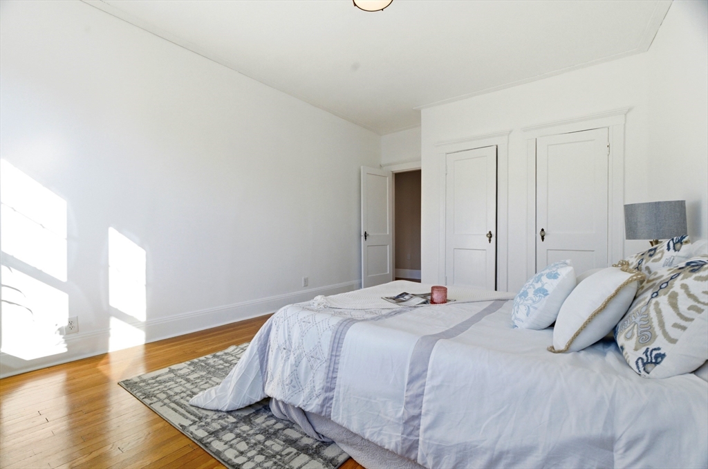 401 Washington Street, Unit 6 Brookline, MA 02446 - Photo 10 of 24 a bedroom with bed and window