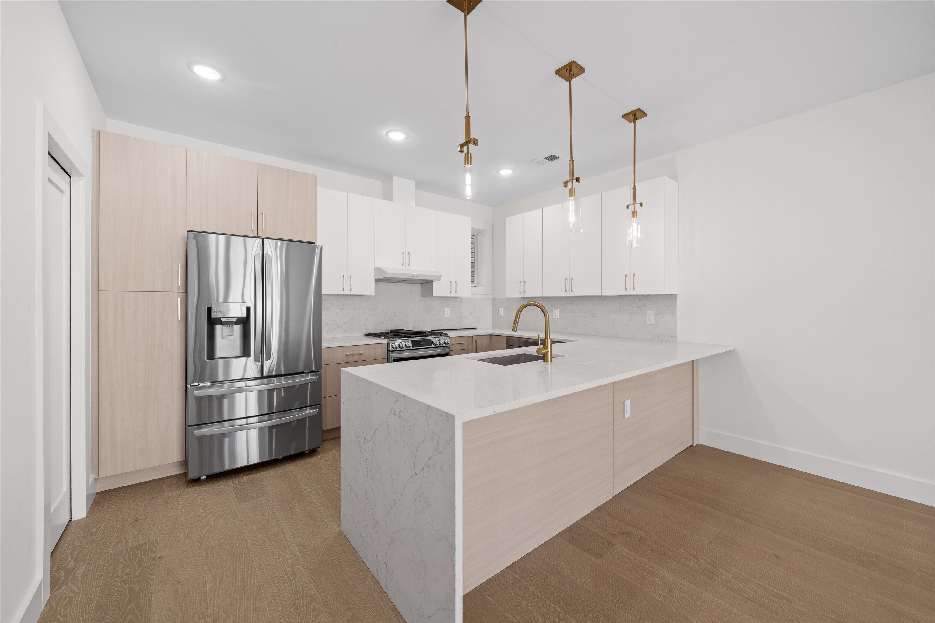 249.5 Halladay Street, Unit 2 Jersey City, NJ 07304 - Photo 2 of 36 a kitchen with stainless steel appliances granite countertop a refrigerator a sink and a stove
