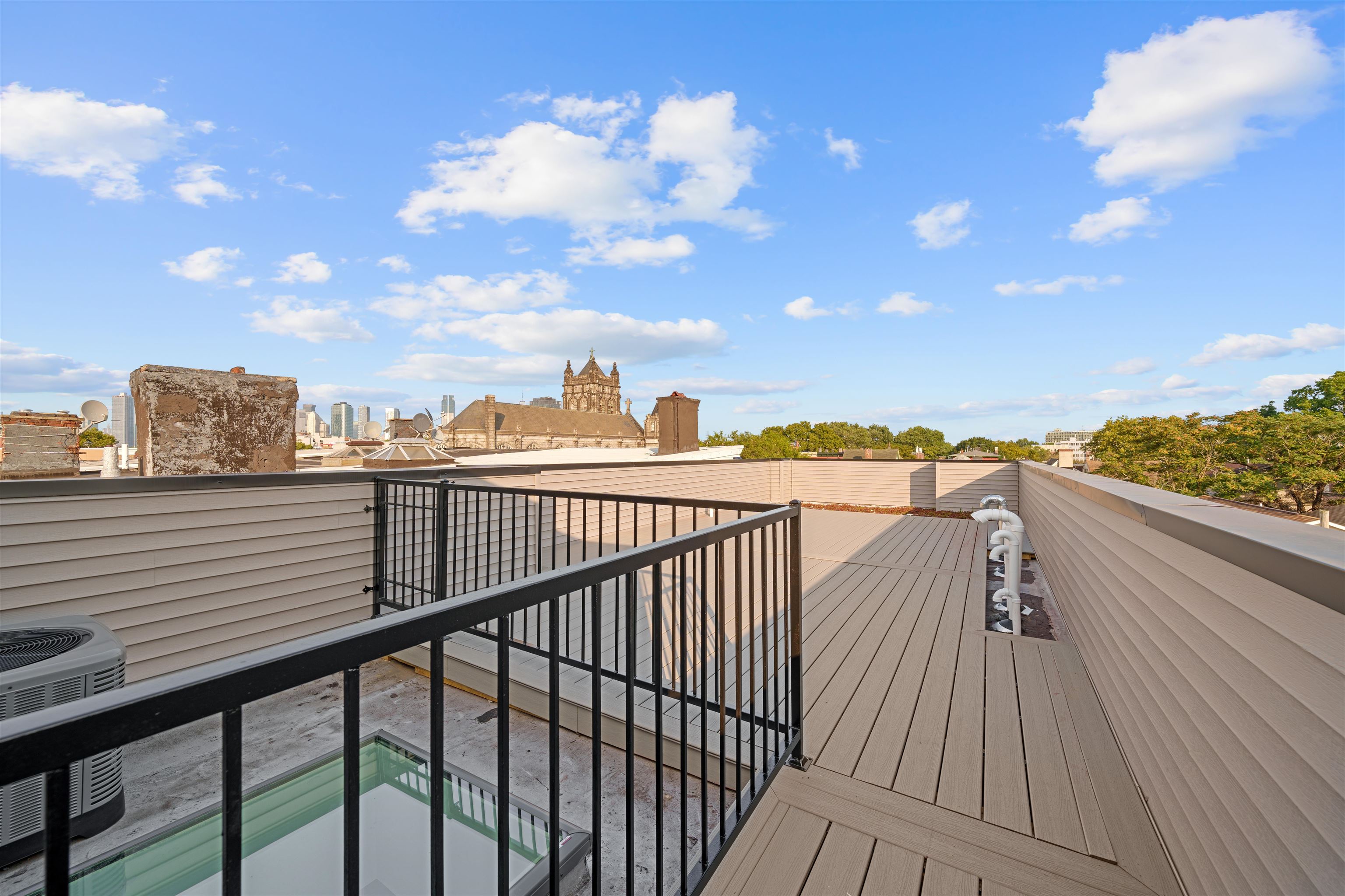 249.5 Halladay Street, Unit 2 Jersey City, NJ 07304 - Photo 26 of 36 a view of city from a balcony
