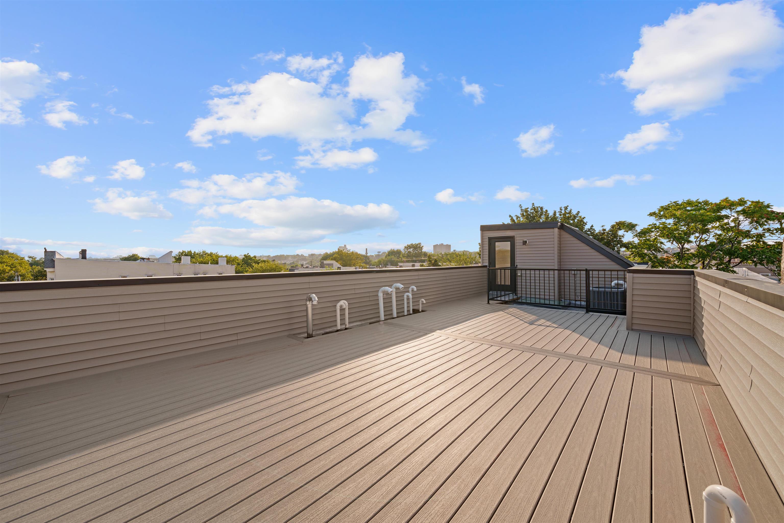 249.5 Halladay Street, Unit 2 Jersey City, NJ 07304 - Photo 28 of 36 a view of a terrace with sky view