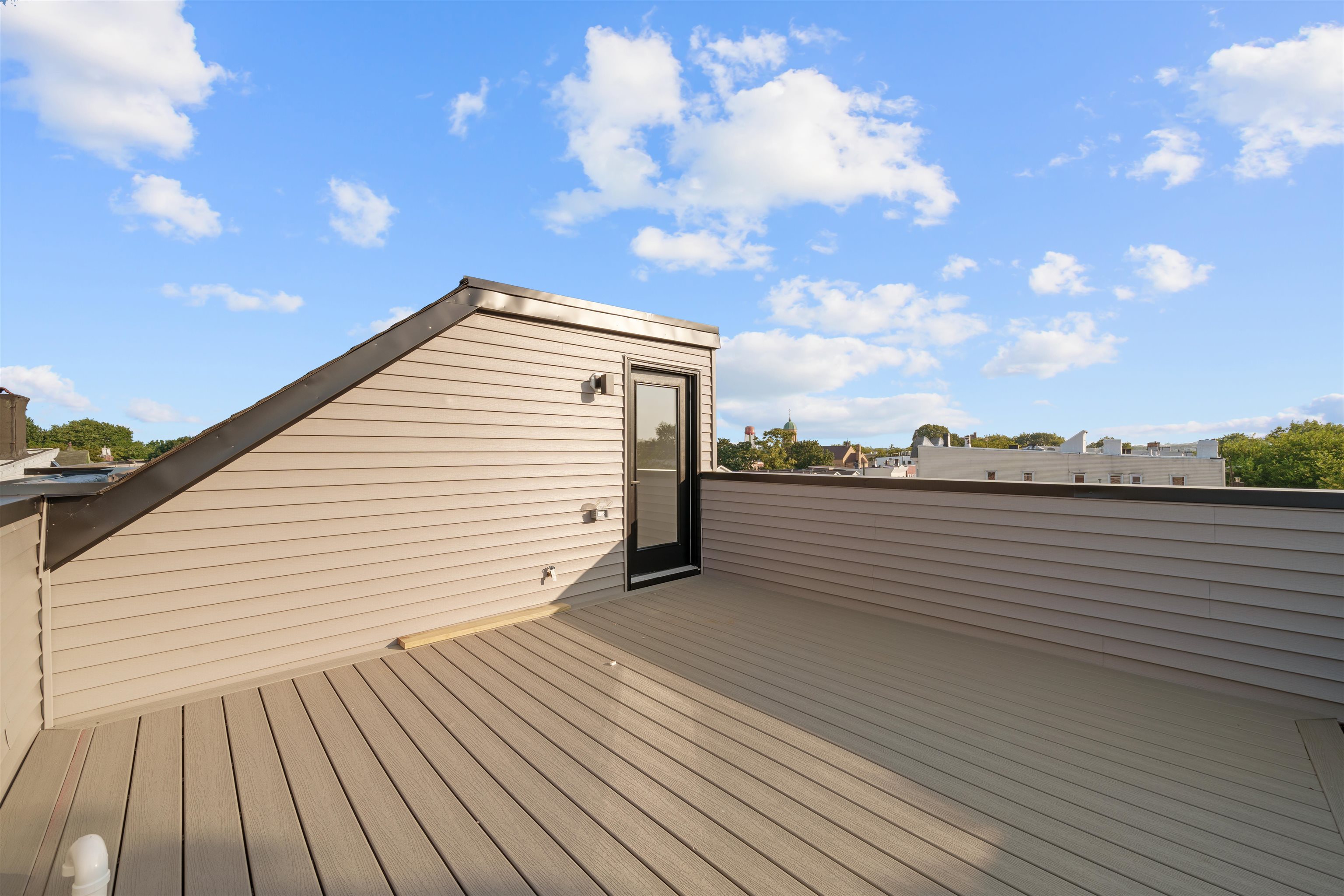 249.5 Halladay Street, Unit 2 Jersey City, NJ 07304 - Photo 30 of 36 a view of a terrace with sky view