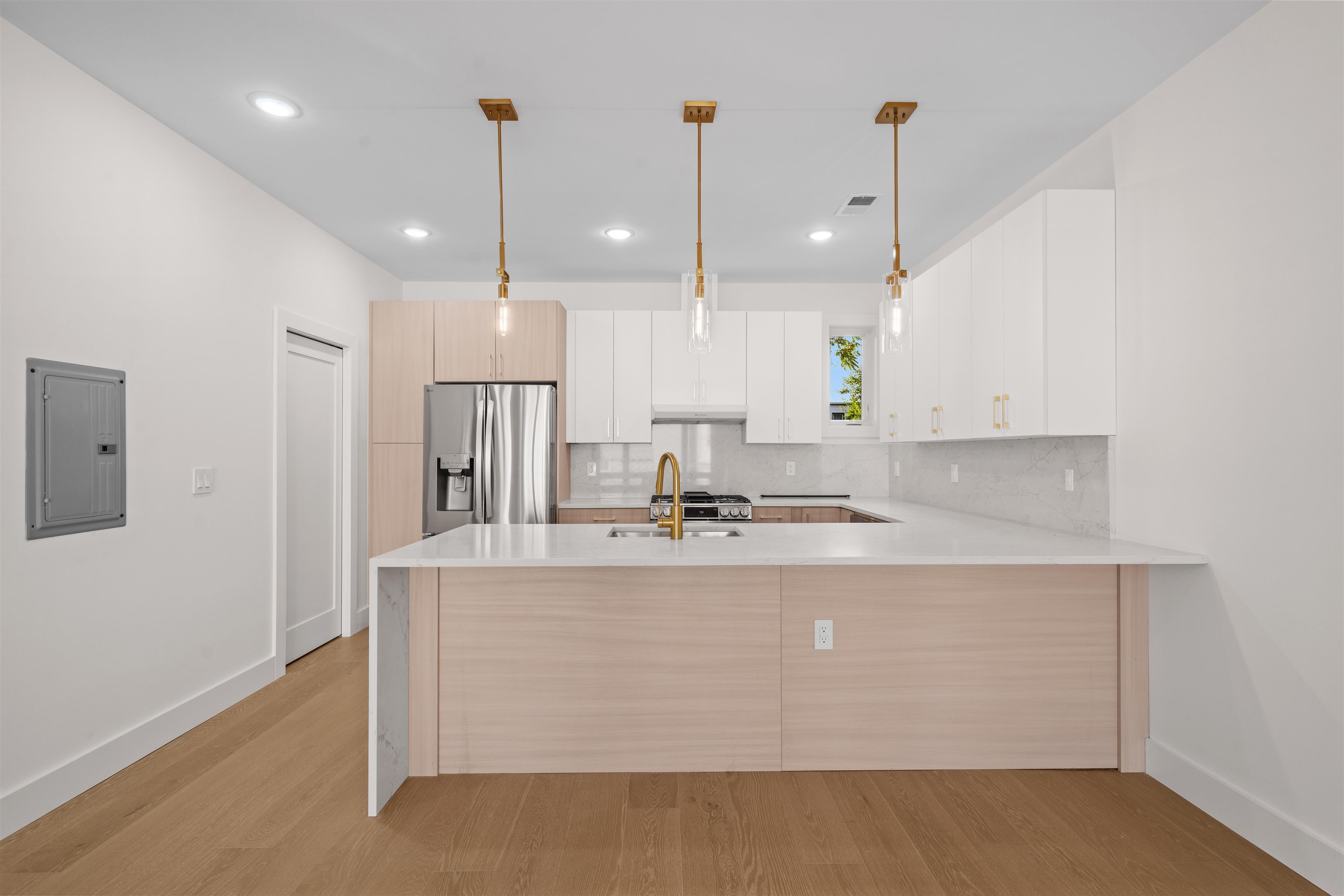 249.5 Halladay Street, Unit 2 Jersey City, NJ 07304 - Photo 4 of 36 a kitchen with kitchen island a counter top space a sink stainless steel appliances and cabinets