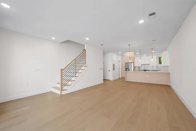 a view of a kitchen with a sink and cabinets
