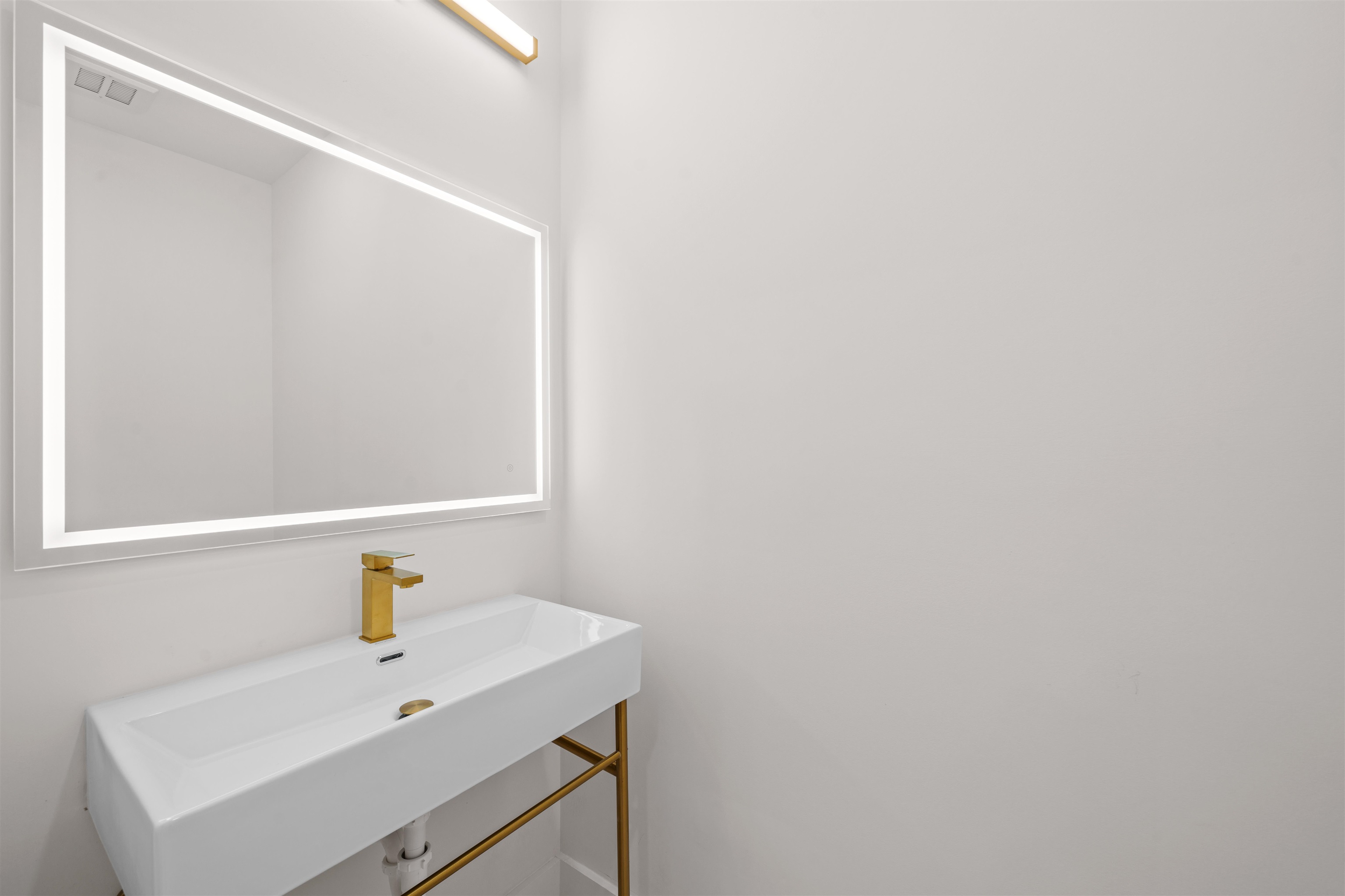 249.5 Halladay Street, Unit 2 Jersey City, NJ 07304 - Photo 8 of 36 a bathroom with a sink and a mirror