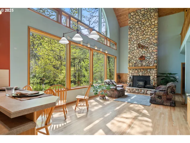 a kitchen with stainless steel appliances kitchen island granite countertop a sink a stove and a refrigerator