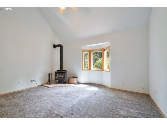 a bathroom with a sink a toilet a mirror and shower