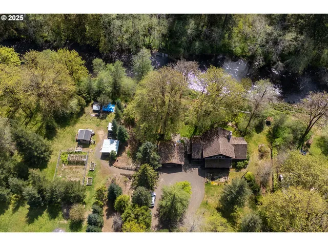 a view of a chairs and table in patio with a backyard