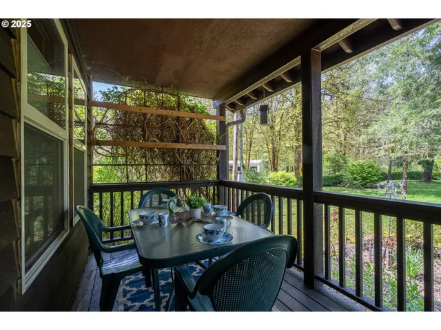 a living room with furniture large window and fireplace