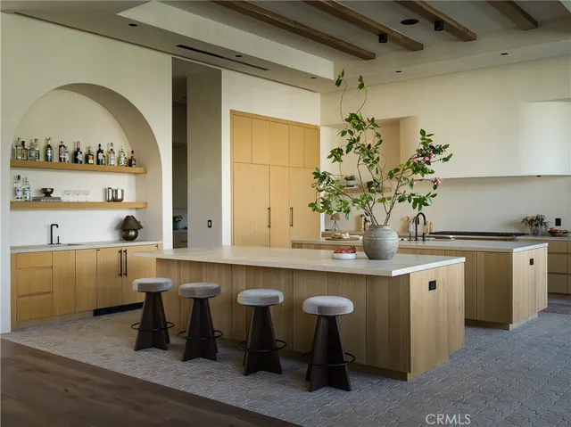 a kitchen with a sink and a refrigerator