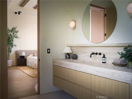 a kitchen with a sink a counter space and cabinets