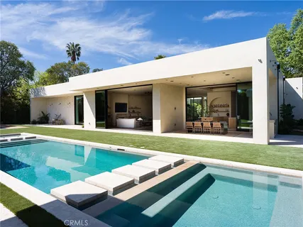 a view of a street with parked cars