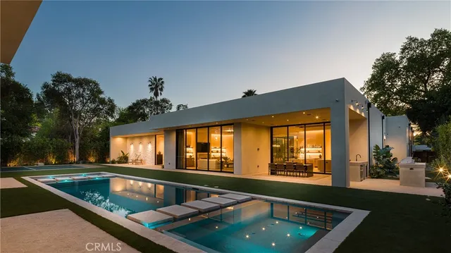 a bedroom with furniture a bed and a large window