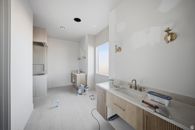 3011 East Rimrunner Drive, Unit 302 St. George, UT 84790 - Photo 22 of 45 Full bathroom featuring vanity and baseboards