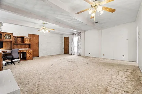 a view of a livingroom with a workspace