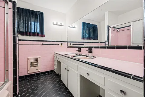 a bathroom with a sink and a mirror