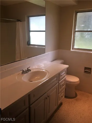 a bathroom with a sink and a toilet