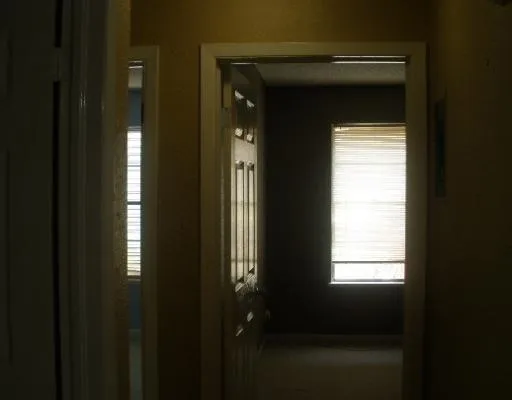 a bathroom with a sink toilet and a mirror