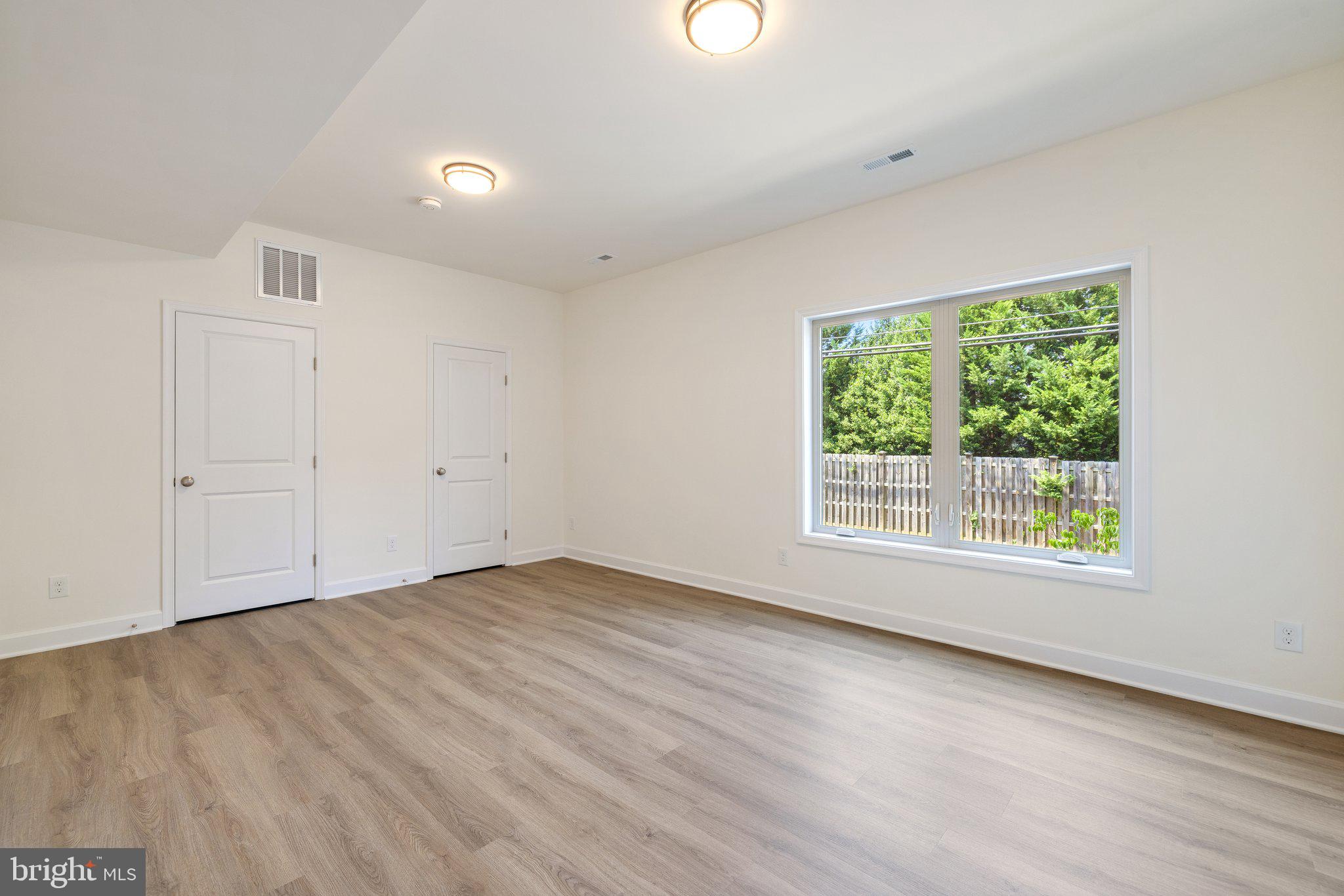 141 Oak View Street Culpeper, VA 22701 - Photo 11 of 46 an empty room with wooden floor and windows
