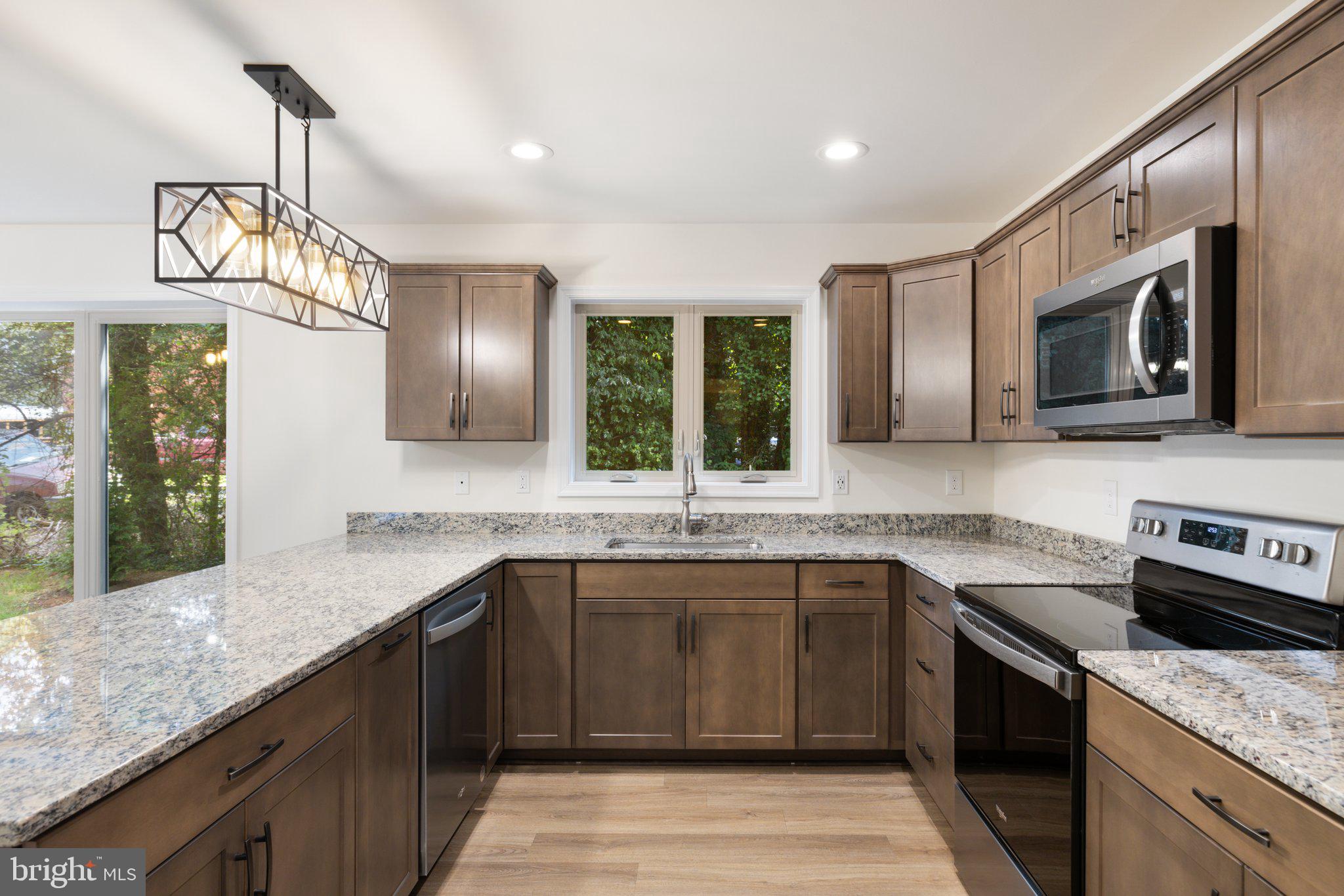 141 Oak View Street Culpeper, VA 22701 - Photo 16 of 46 a kitchen with stainless steel appliances granite countertop a sink stove and microwave