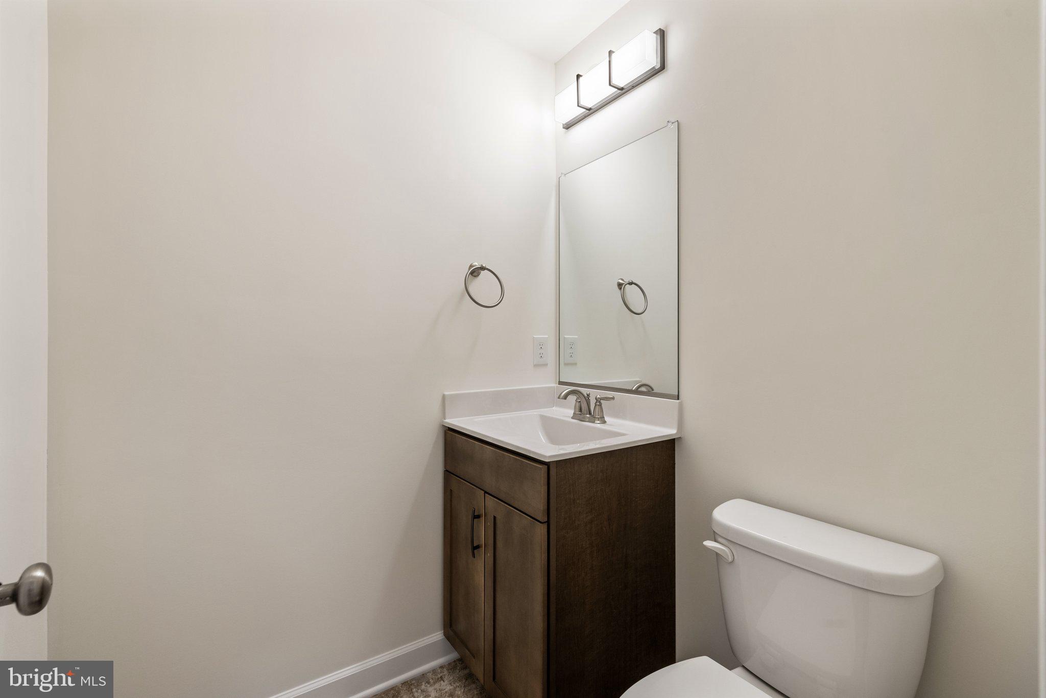 141 Oak View Street Culpeper, VA 22701 - Photo 22 of 46 a bathroom with a toilet a sink and mirror