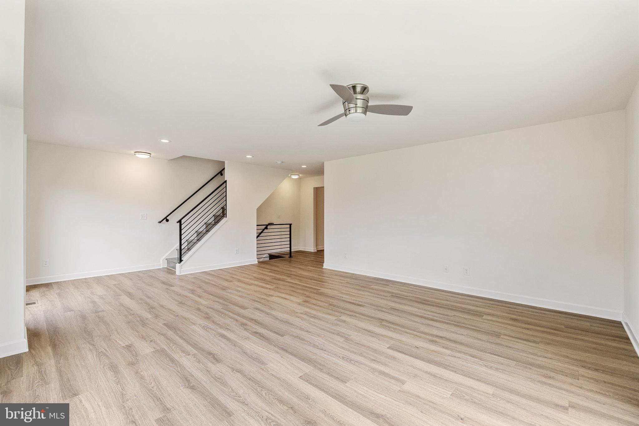 141 Oak View Street Culpeper, VA 22701 - Photo 24 of 46 a view of empty room with wooden floor and ceiling fan