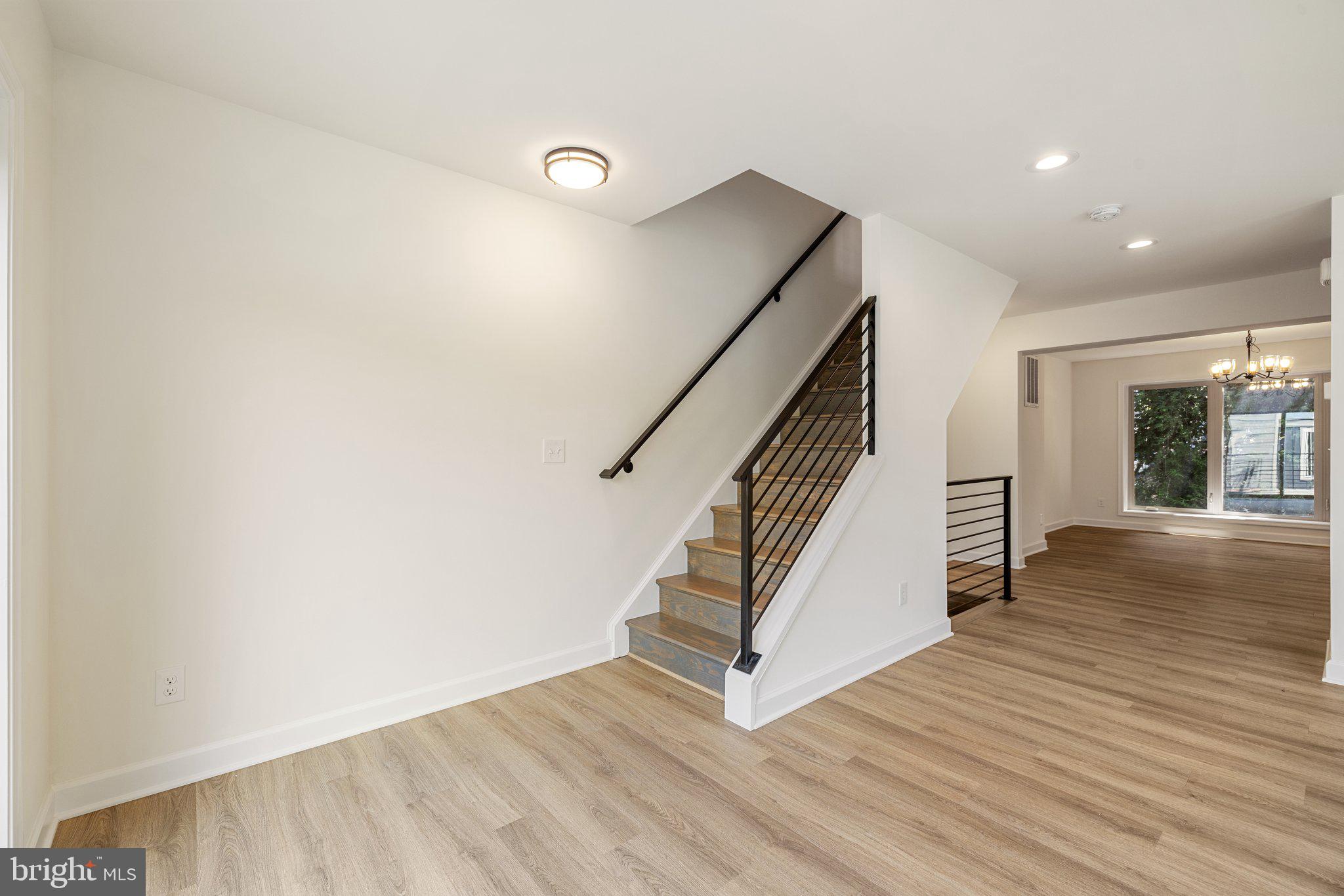141 Oak View Street Culpeper, VA 22701 - Photo 29 of 46 an entryway in a hall with wooden floor and stairs