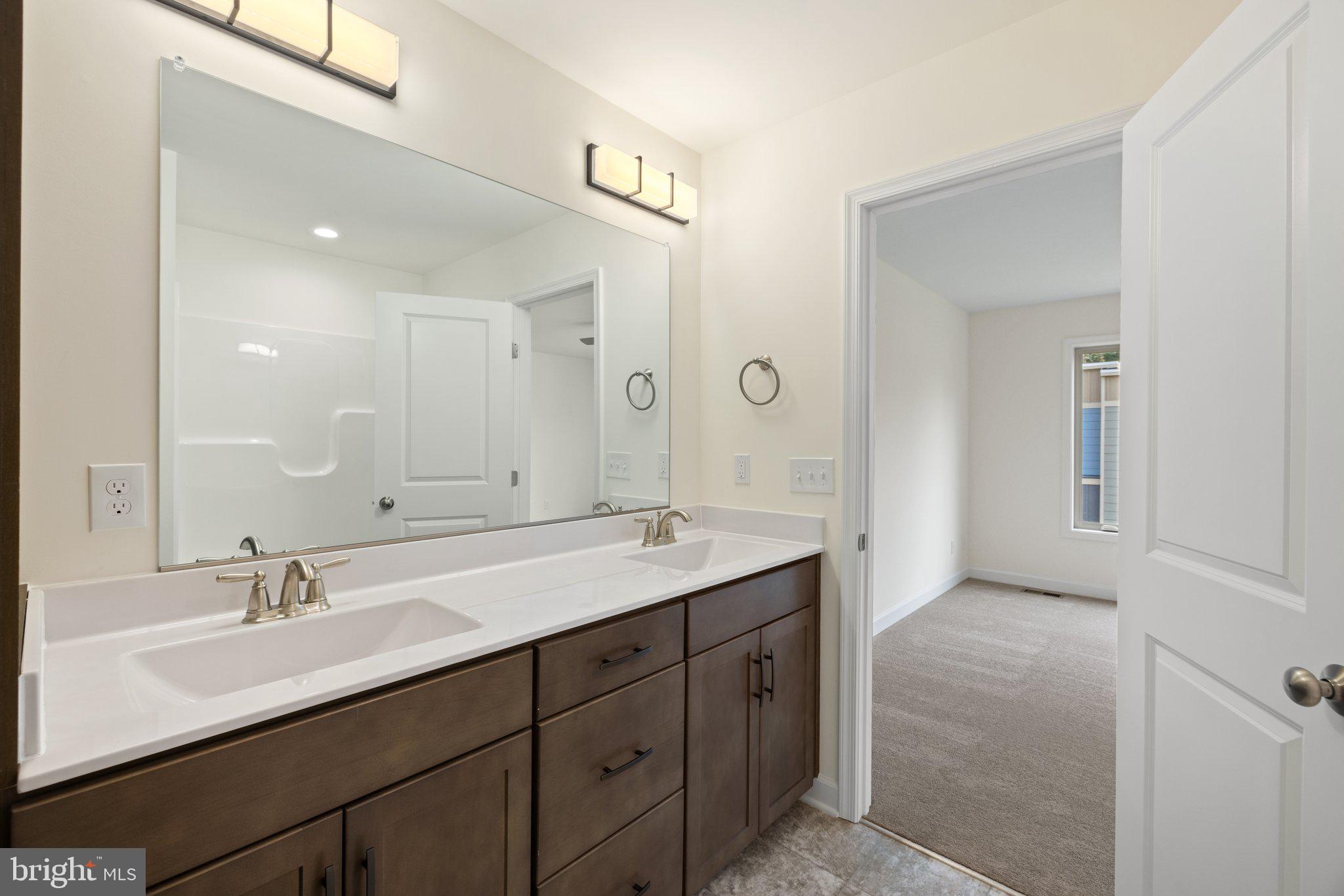 141 Oak View Street Culpeper, VA 22701 - Photo 38 of 46 a bathroom with double vanity sinks and a mirror
