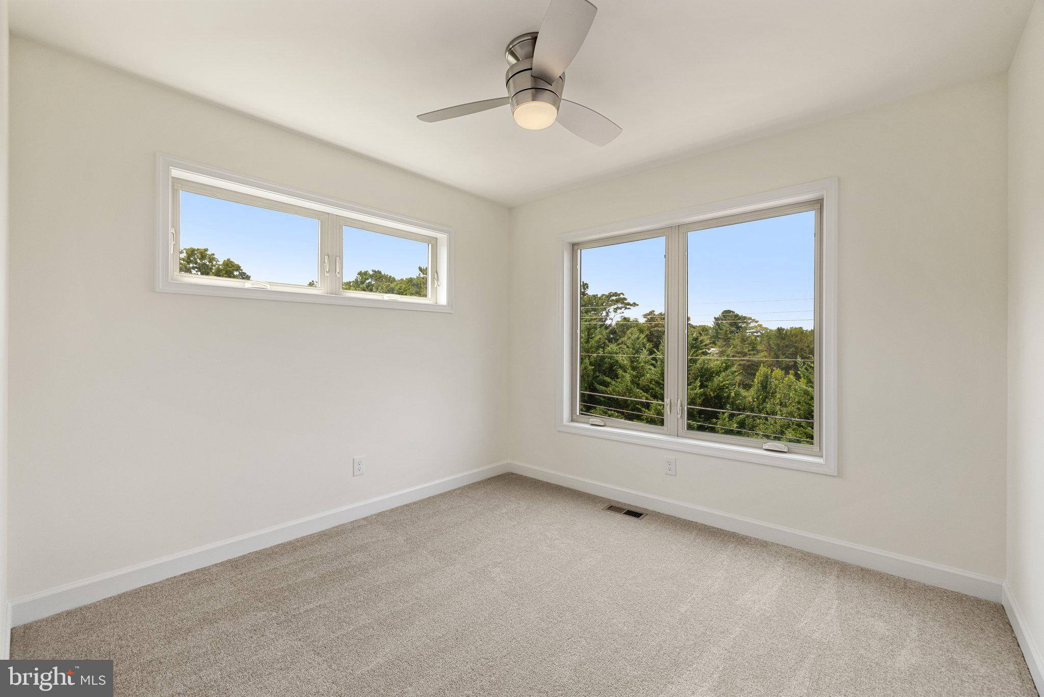 141 Oak View Street Culpeper, VA 22701 - Photo 40 of 46 an empty room with windows and ceiling fan
